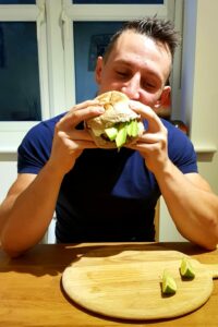 Josh eating his healthy burger